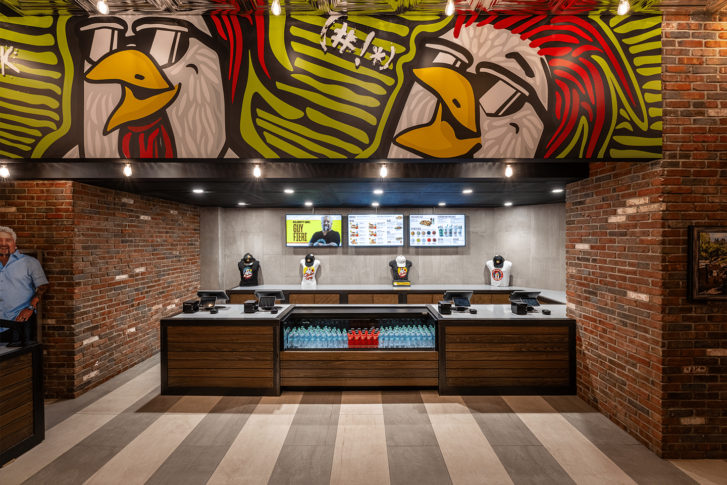 Modern Chicken Guy! New York City storefront featuring a bold chicken mural, digital menu boards, and a stylish ordering counter.